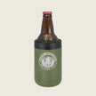 Green bottle cooler with a beer bottle on a beige background