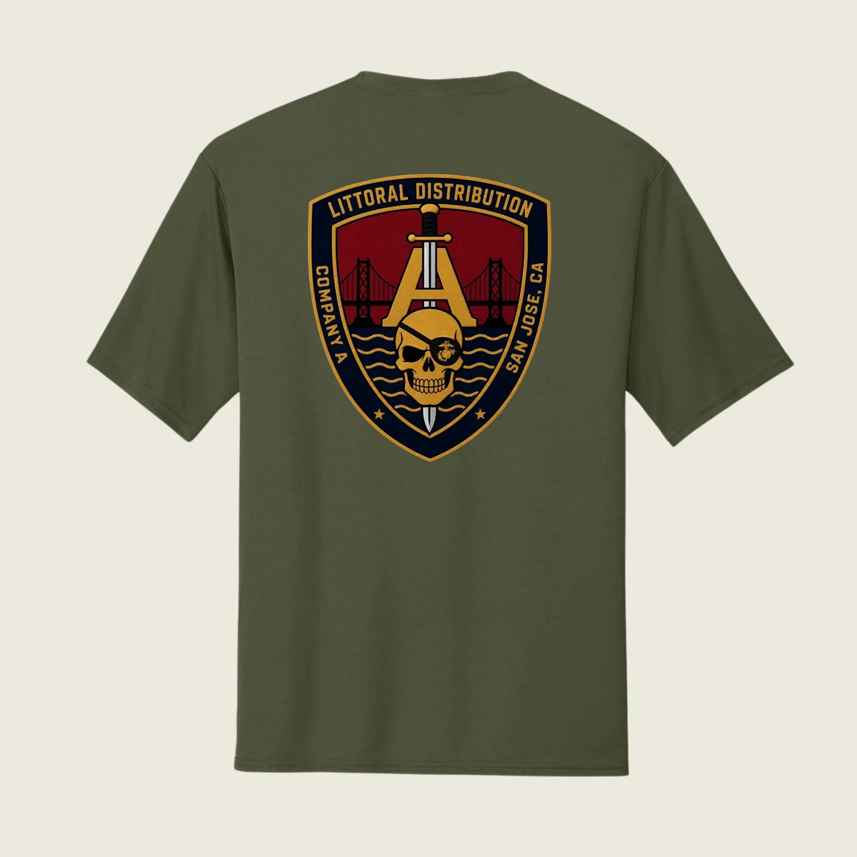 An olive green short-sleeve t-shirt shown from the back, featuring a large military-style crest graphic on the center back with a gold anchor, skull, bridge, and text reading 'LITTORAL DISTRIBUTION' and 'COMPANY A SAN JOSE CA'.